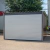 Motorgarázs, kerti tároló, elektromos kapuval, famintás oldalfalakkal, Woody, 3 x 3m
